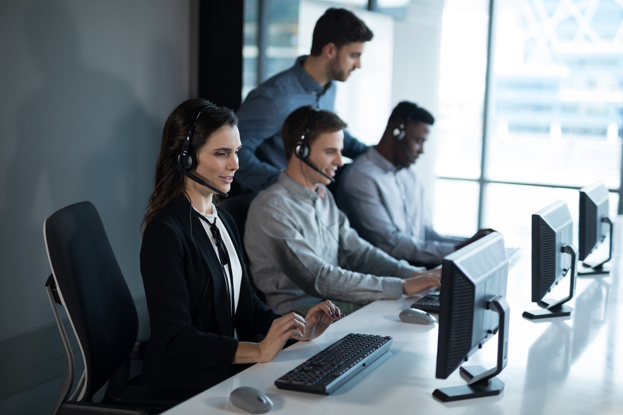 Customer service executive trainer monitoring her team